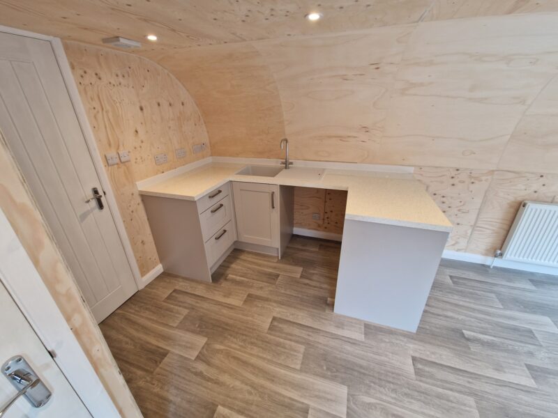 Alternate angle of open plan living area and kitchenette in eLodge Max garden lodge