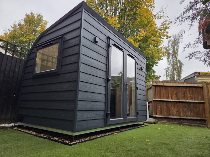 Alternate angle of eSnug Plus garden studio in Warrington showing double doors and exterior lights